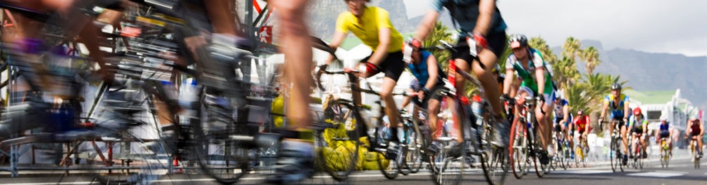 A blurred mass of cyclists taking part in a race